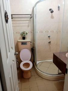 a bathroom with a toilet and a shower at Ujana Kingfisher double storey 3 Bedroom - Farah Biz Homestay in Kota Kinabalu +29 photos
