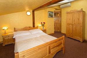 Postel nebo postele na pokoji v ubytování Hotel Retman