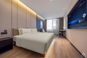 Postel nebo postele na pokoji v ubytování Atour Hotel Beijing Bird's Nest Datun Road East Subway Station