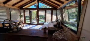 a room with a bed in a room with windows at Studio Belvedere in Mălăeşti +9 photos