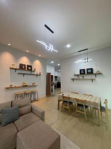 a living room with a couch and a table at Private Pool KTV Family Villa 3R 12Pax by I Housing in Kampong Solok Haji Dollah