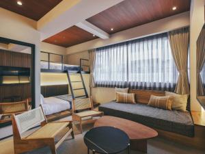 a living room with a bunk bed and a couch at illi Mani Shibuya in Tokyo