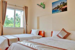 Postel nebo postele na pokoji v ubytování S79 Lam Ha Pool