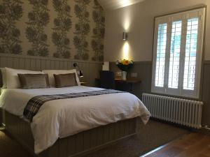 a bedroom with a large bed and a window at Irvine Bay in Irvine