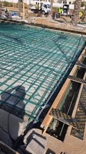 an overhead view of a swimming pool under construction at jeddah in Dubai