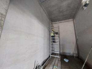 a man standing on a ladder in a room at jeddah in Dubai
