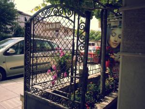 A garden outside Villa Diana Self check-in