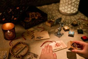 a person playing with a bunch of items on a table at OMO3 Kyoto Toji by Hoshino Resorts in Kyoto +94 photos