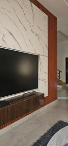a large flat screen tv on a wall at Roak Hotels and Apartments in Abuja