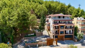 an aerial view of a building with trees at Castello By Mediterra Hotel in Alanya