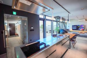 a kitchen with a sink and a counter top at amairo Villa in Asahikawa