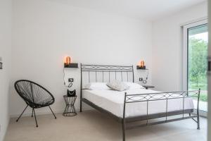 Katil atau katil-katil dalam bilik di Armonia Suites - Aria e Fuoco