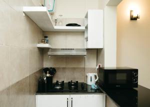 Kuchyň nebo kuchyňský kout v ubytování Ma-xels Home Couple's Suite