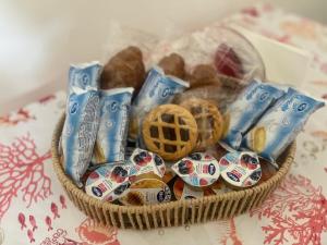 a basket of cookies and other snacks on a table at House Federica in Melfi