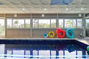 a swimming pool with toys in the middle of it at Daebudo DuMong DalGeum Pool Villa in Ansan