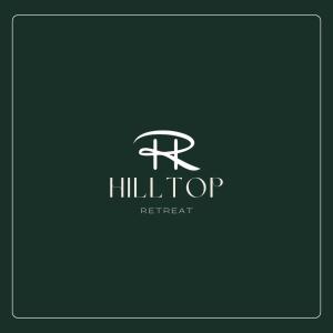 JāmbにあるHilltop retreatの「hiltonitant」というイニシャルのホテルのロゴ
