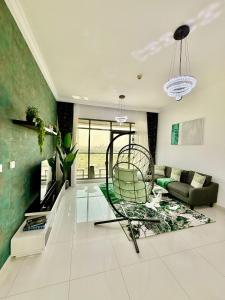 a living room with a chair and a couch at Spacious Luxury Lagoon View 2Bhk in Dubai