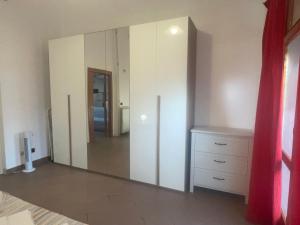 a large mirror in a bedroom with a dresser at Il Rifugio in San Giacomo degli Schiavoni +50 photos