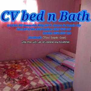 a poster for a cly bed n bath with a bed in a room at CV Bed n Bath in Baguio