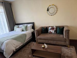 Ένα ή περισσότερα κρεβάτια σε δωμάτιο στο Wasaa Anasa at Norton Manor +1 φωτογραφίες