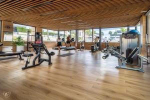 a gym with several treadmills and machines in a room at NEW - Flamenca Village - fantastic location! in Orihuela