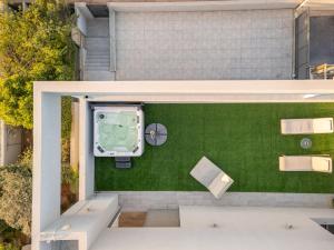 an overhead view of a backyard with a boat on a lawn at Olga Resort - אולגה ריזורט in H̱adera
