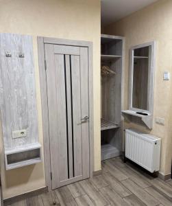 a room with a closet with a door and shelves at Coffee Room in Odesa +59 photos