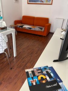 a living room with a couch and a table at Dimora 14 in Termoli