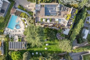 an overhead view of a house with a pool and yard at Hotel Mignon Meran Park & Spa in Merano