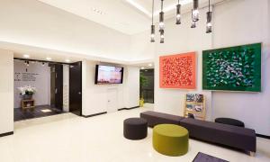 TV a/nebo společenská místnost v ubytování Raonstay in Perla Hotel