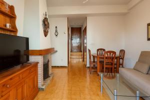 a living room with a couch and a table at Ola Azul Bungalow II in Benidorm