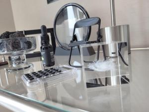 a glass counter top with a mirror and a sink at Busan Station KTX 30s Ocean View 부산역ktx 30초 오션뷰 in Busan +113 photos