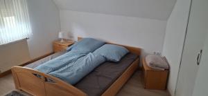 Кровать или кровати в номере Ferienhaus Meinheim