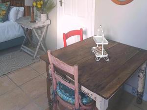 a wooden table with a stroller on top of it at Nouvelle Vie Self-catering Accommodation in Reebok