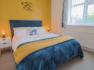 Ένα ή περισσότερα κρεβάτια σε δωμάτιο στο Cedar Drive