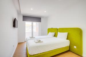 Katil atau katil-katil dalam bilik di GuestReady - Modern charm in Setúbal