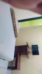 a view of a bathroom with a toilet in a room at HOTEL OM VADODARa in Vadodara