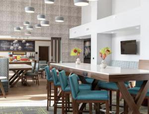 a dining room with a large table and chairs at Hampton Inn & Suites By Hilton Durango Downtown Area in Durango