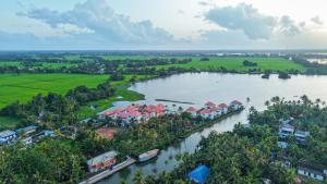 an aerial view of a resort on a river at Alaya Stays Paloma Backwater Resort in Alleppey +4 photos