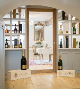 a room with two bottles of wine on display at Le Clos Haton - HAUTVILLERS in Hautvillers