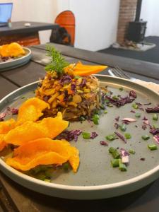 a plate of food sitting on a table at Journey Junction Hostel in Nuwara Eliya