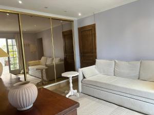 a living room with a couch and a table at Domaine Chapelle in La Chapelle-la-Reine +142 photos