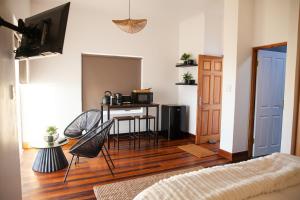 a living room with a table and chairs at Seaside Studio in Yzerfontein