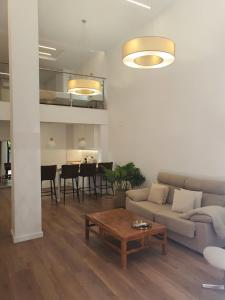 a living room with a couch and a table at Espacio 21 in Córdoba