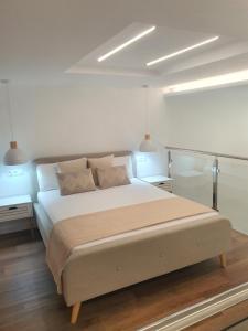 a bedroom with a large bed with two night stands at Espacio 21 in Córdoba