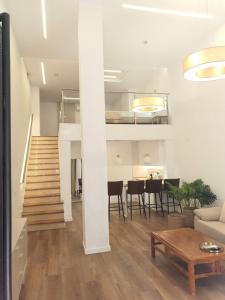 a living room with a couch and a table at Espacio 21 in Córdoba +15 photos