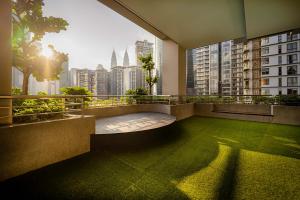 a balcony of a building with a view of a city at Panorama Suites at Manor Kuala Lumpur in Kuala Lumpur