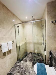 a bathroom with a glass shower and a sink at Panorama Suites at Manor Kuala Lumpur in Kuala Lumpur