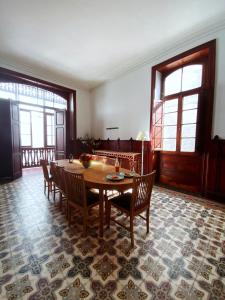 a dining room with a table and chairs at Comfortable Room in Historic Casa Quesada Shared House in Las Palmas de Gran Canaria +50 photos