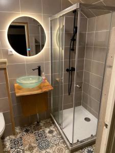 a bathroom with a shower and a sink at Hippie Beach in Zandvoort +27 photos